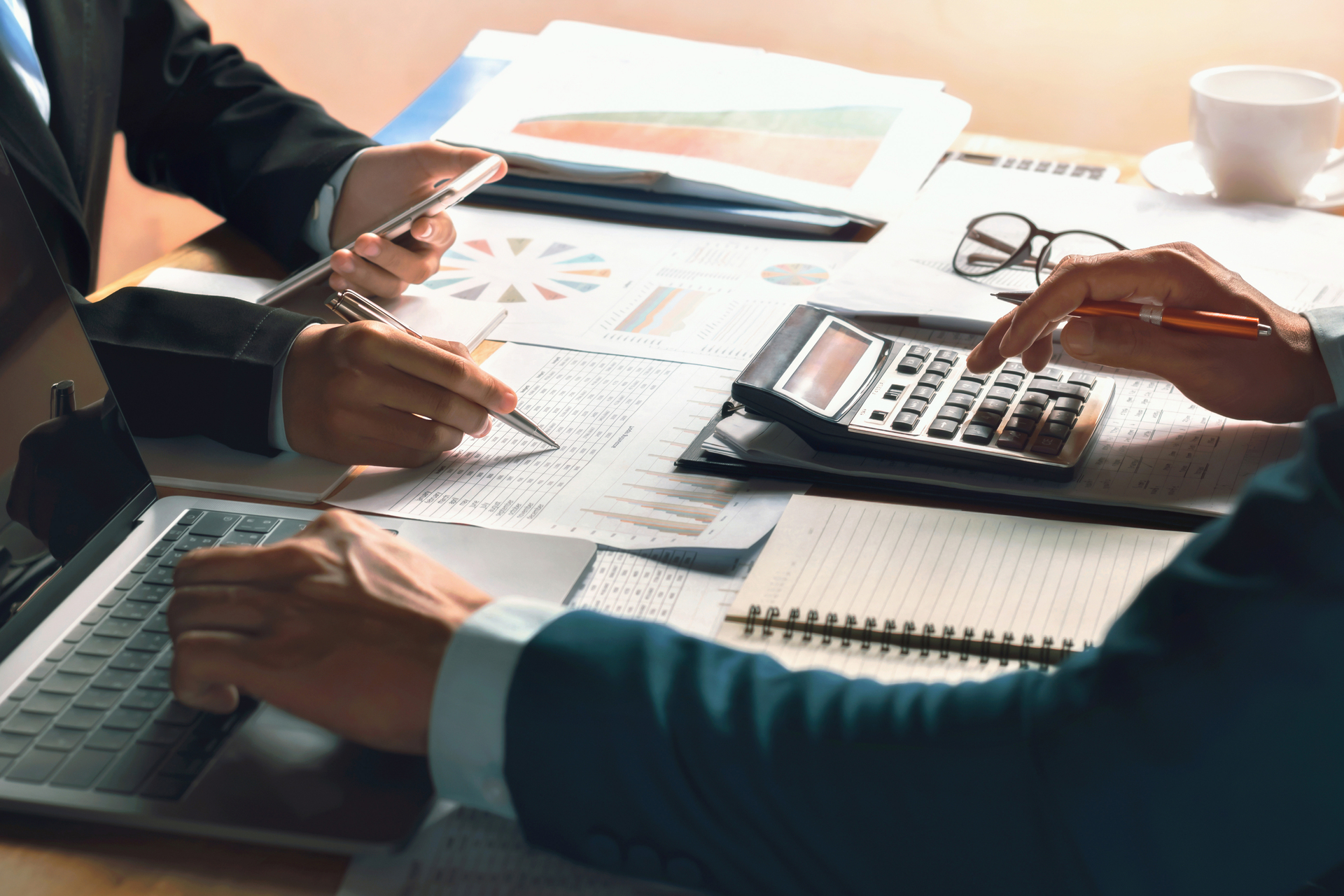 businessmen completing a financial audit or report